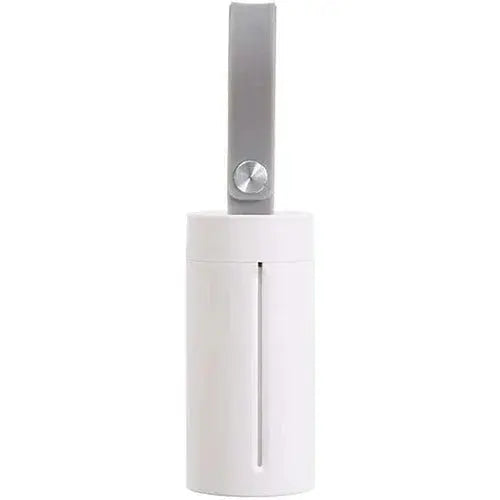 White portable pet water bottle with gray strap, ideal for coastal dog walks and travel