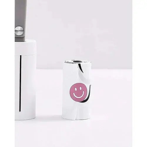 Coastal Paw & Co white pet waste bag dispenser with refill roll featuring pink smiley face on white background