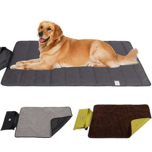 Golden retriever lying on a gray waterproof pet mat with two folded mats in gray and brown colors
