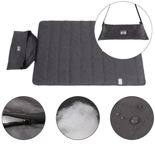 Black waterproof pet travel mat with carry bag, zipper detail, soft filling, and water-resistant fabric
